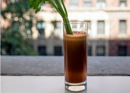 Juice in glass with celery
