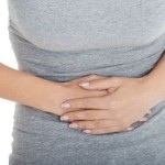 Woman holding stomach
