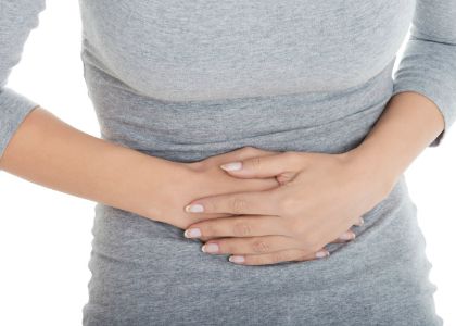 Woman holding stomach