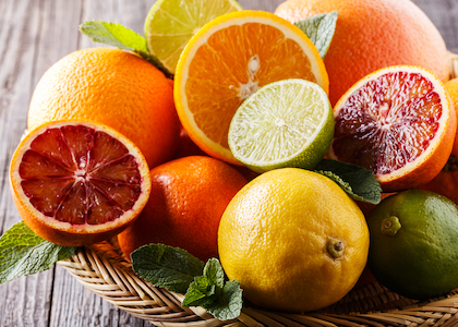 Assorted fresh citrus fruits.